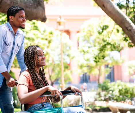 african-american-woman-wheelchair-enjoying-walk-park-with-her-boyfriend (1)